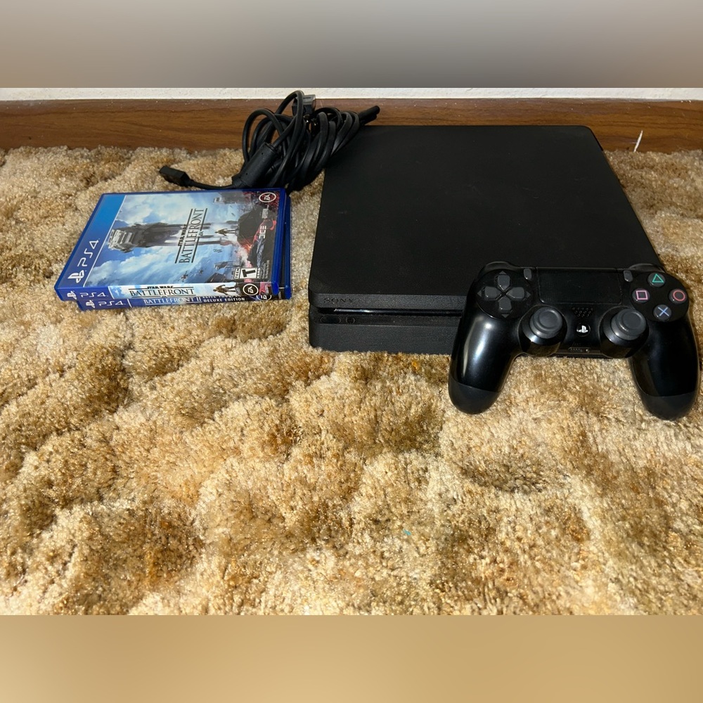 PlayStation 4 Slim. 1 TB storage. 1 controller. All cords.2 star-wars games